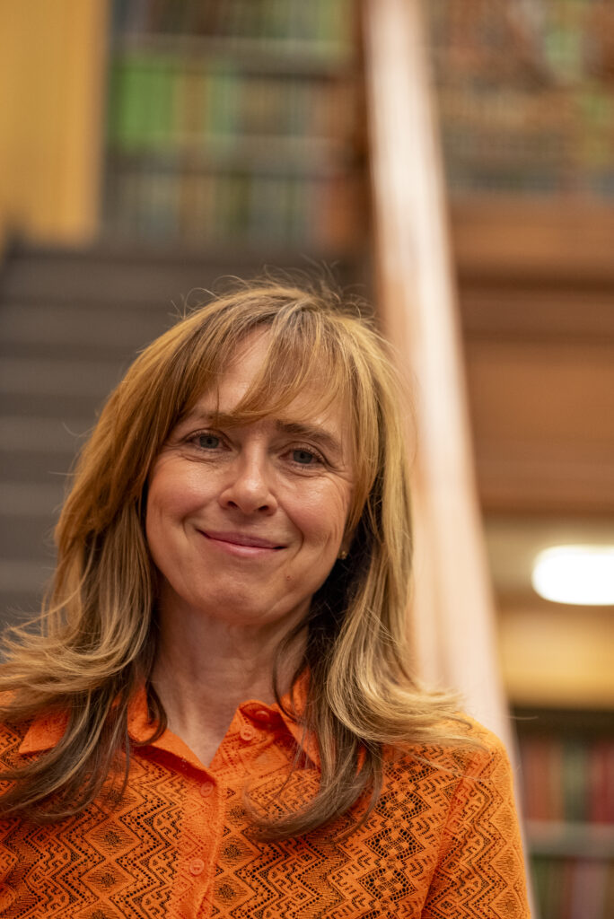 Headshot of Lilia Maliar, standing in GC Library